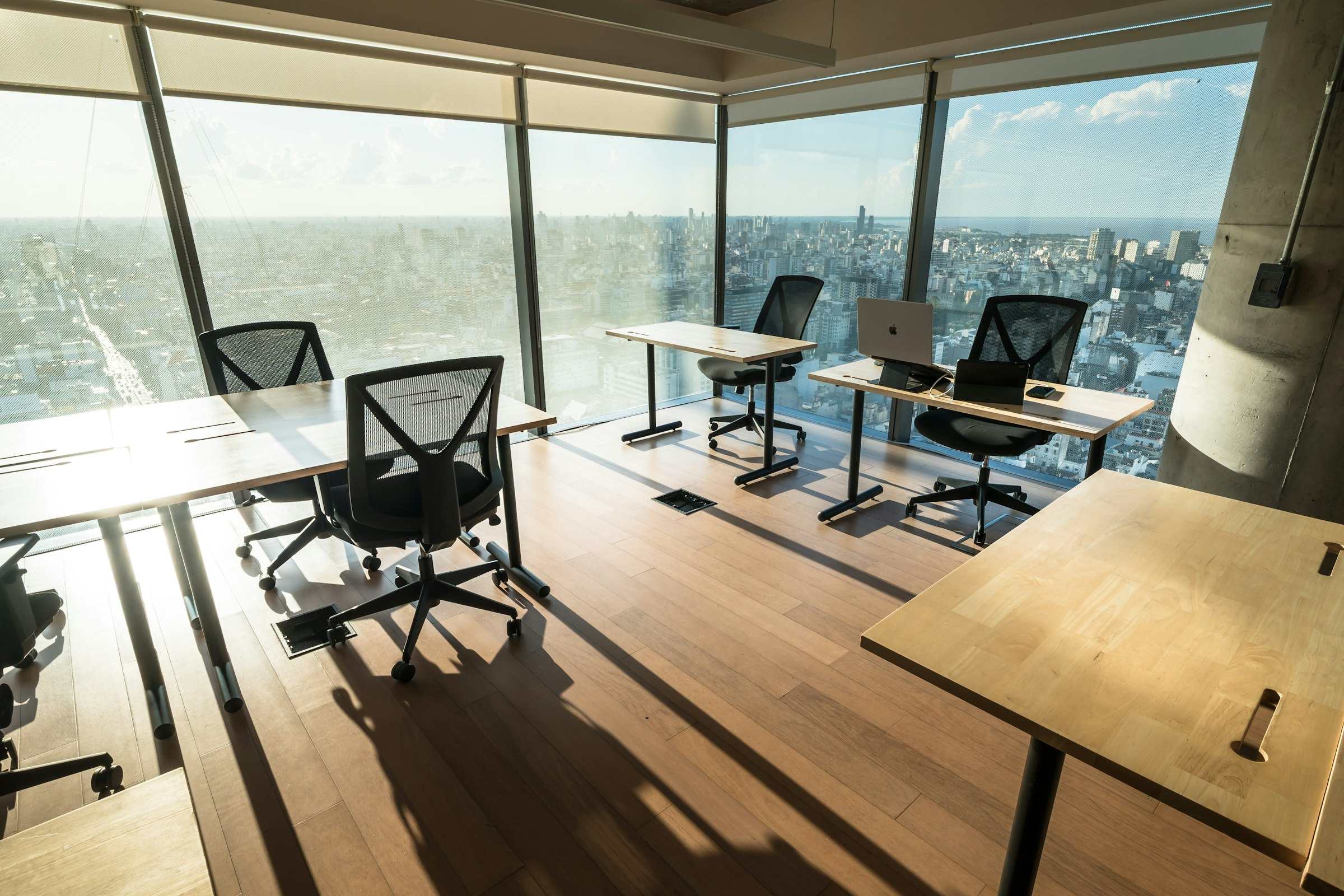 A commercial office floor fitted out with assembled desks and chairs